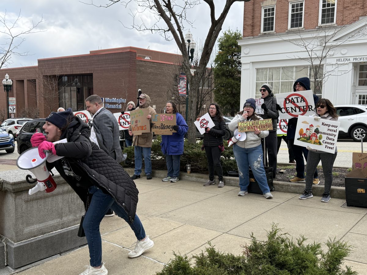 Group protests data centers outside private event